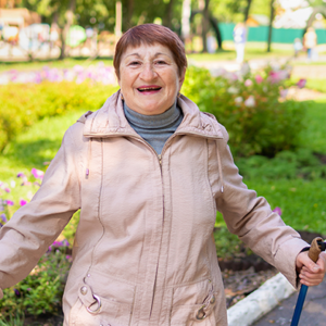 woman walking in the park with walking sticks